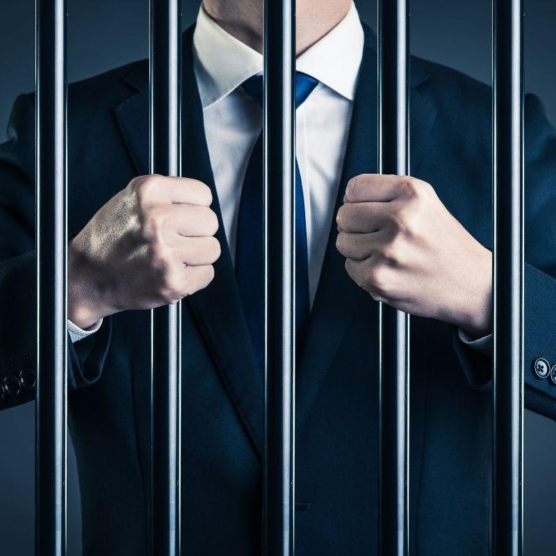 businessman-behind-bars-800x800-1-aspect-ratio-800-800