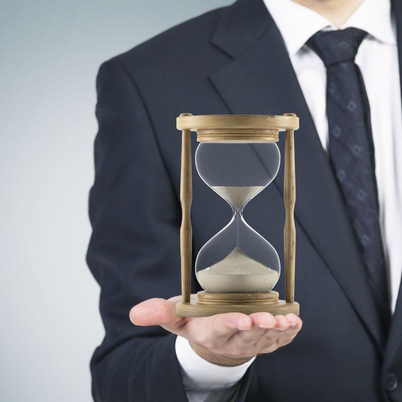 man-in-suit-holding-hourglass-800x800-1-aspect-ratio-800-800